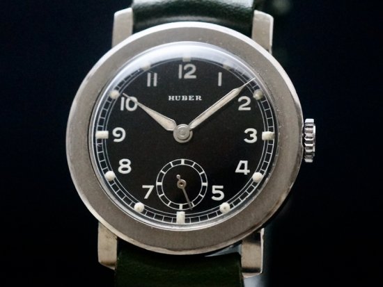 HUBER / BLACK MIRROR DIAL, WIDE FLAT BEZEL, FLEXIBLE LUGS 1940'S