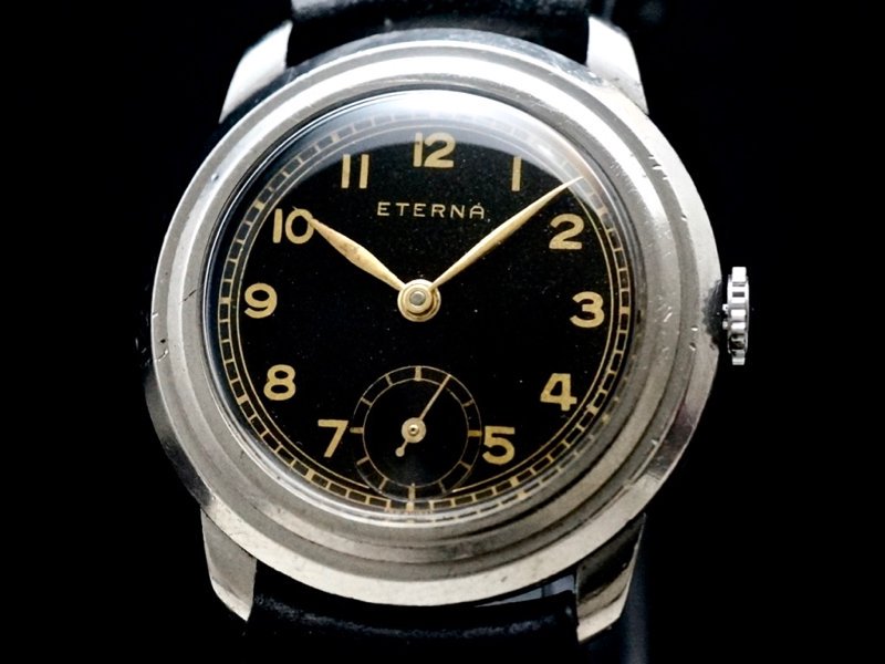 ETERNA / LARGE DRAPED CASE, BLACK GILT DIAL 1930'S